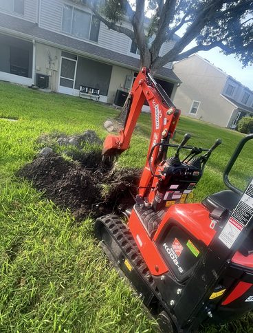 Mini-excavator trenching for a new irrigation system in Killeen, Texas