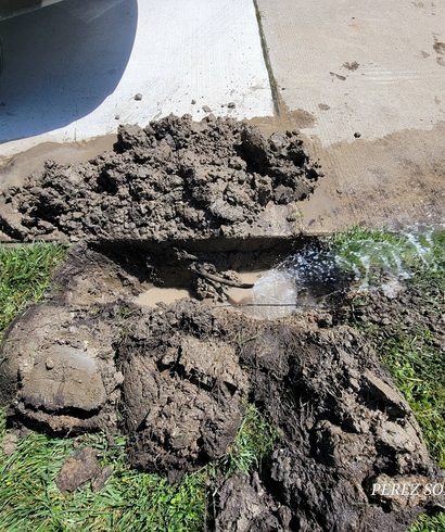 Zone Leak Repair Beside a City Sidewalk