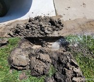 Zone Leak Repair Beside a City Sidewalk