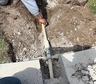 Boring a New Irrigation Line Under a Concrete Walkway